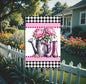 This watering can with bright oink peonies and rubber boots will be perfect for your yard decor.