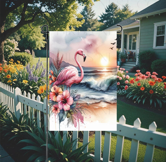 An adorable pink Flamingo on a Beach surrounded by Hibiscus Flowers.