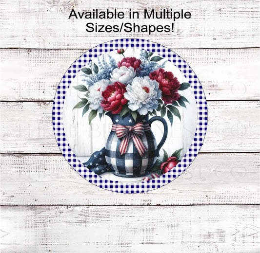 A beautiful rustic primitive vase of red, white, and blue flowers and peonies with a Patriotic bow.