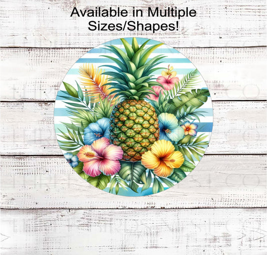 A beautiful Pineapple surrounded by palm leaves and hibiscus flowers.
