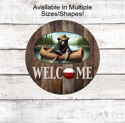A Grizzly Bear in a canoe, fishing for trout with a Welcome message and fishing bobber.