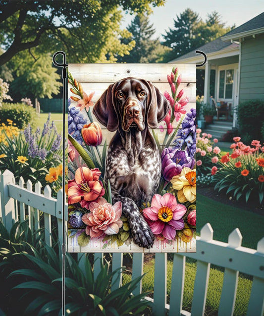 An adorable German Shorthaired Pointer Dog surrounded by Spring Flowers.