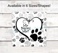 
              Who Rescued Who Black and White Paw Prints Dog Sign
            