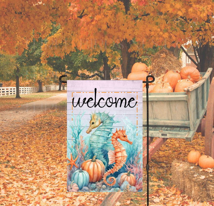 A pastel underwater view with two beautiful Seahorses, coral and pastel pumpkins with a Welcome message.