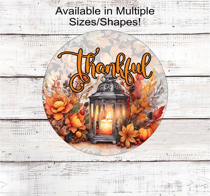 A beautiful glowing lantern surrounded by pumpkins and Fall flowers