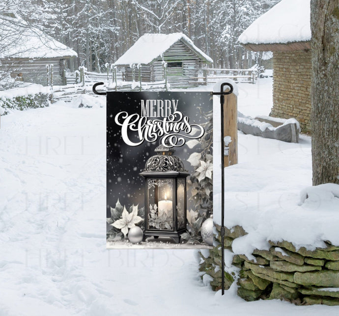 A black and white monotone image of a beautiful black/silver lantern with white and silver poinsettias and Christmas ornaments