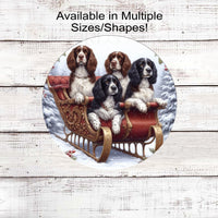 Four English Springer Spaniel Dogs sitting in a fancy Sleigh in a winter snowy setting