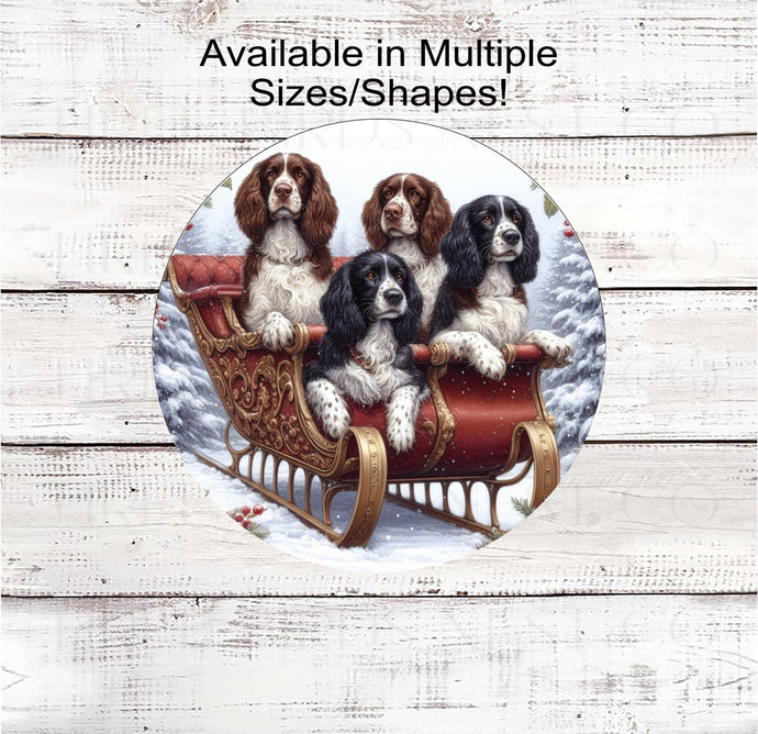 Four English Springer Spaniel Dogs sitting in a fancy Sleigh in a winter snowy setting