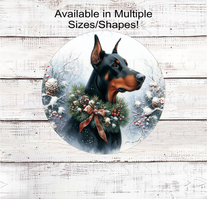 A black and rust Doberman Pinscher dog in a winter wonderland