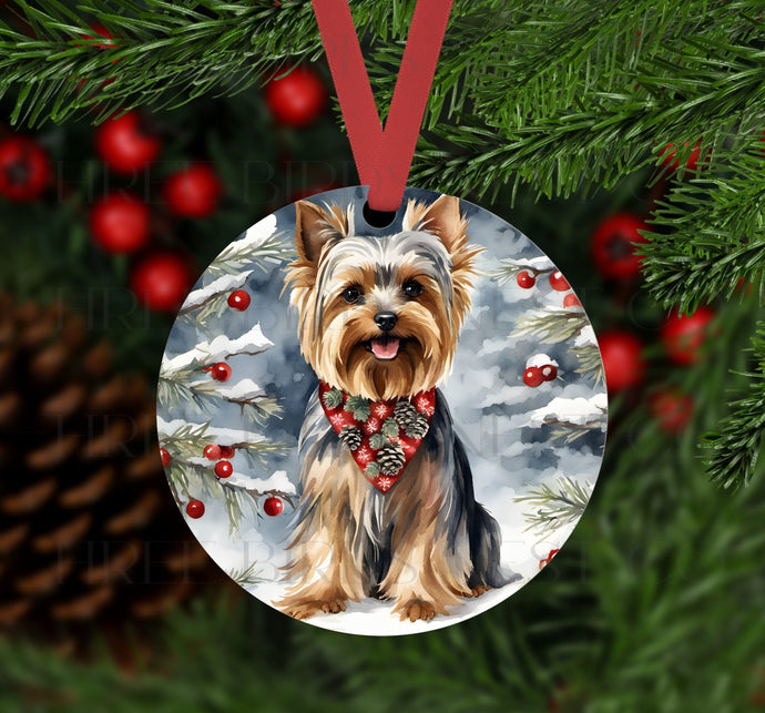 An ornament with a Yorkshire Terrier dog in a Winter setting