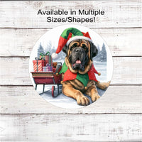 
              An adorable English Mastiff dressed as a Christmas Elf next to a sleigh filled with presents.
            