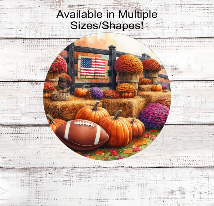 Hay Bales with an American Flag, Pumpkins and Mums and a Football for Fall