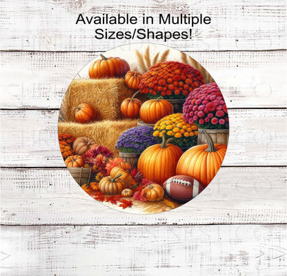 Hay Bales with Pumpkins and Mums and a Football for Fall