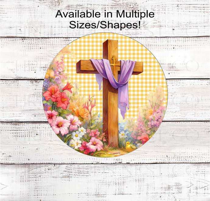 A beautiful Easter Cross with a purple sash surrounded by Spring Flowers on a yellow gingham background.
