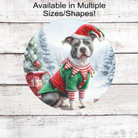 An adorable grey and white Pit Bull Dog dressed as a Christmas Elf.