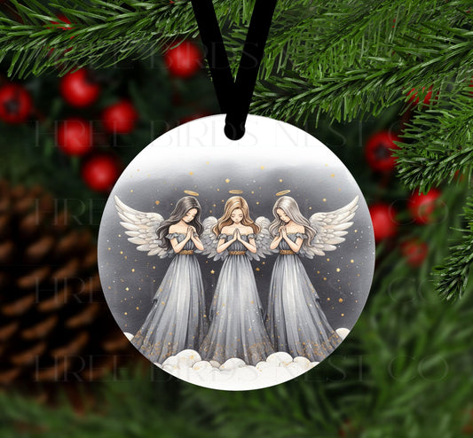 A trio of beautiful Christmas Angels with their hands together in prayer.