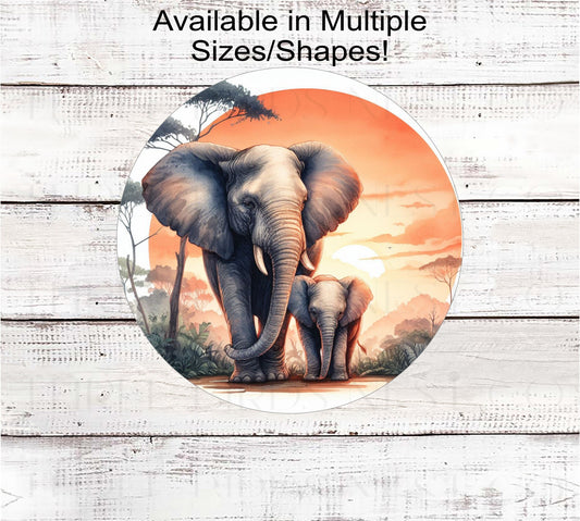 An adult Elephant with a Baby Elephant in the Jungle at sunset.