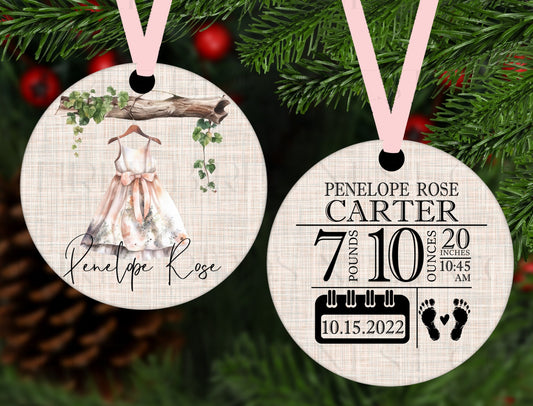 An adorable Christmas Ornament with a watercolor girl&#39;s dress and birth stats on the back.