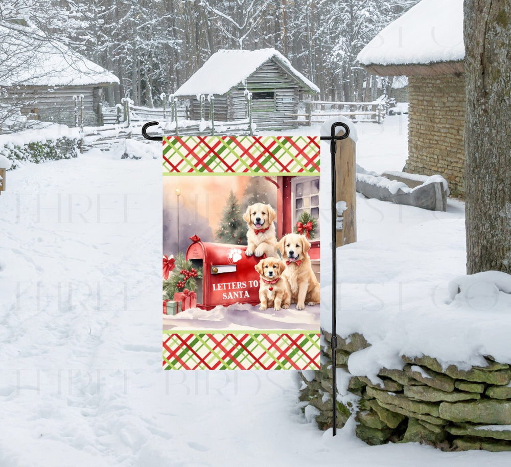An adorable trio of Golden Retrievers next to a Christmas mailbox that's marked Letters to Santa.