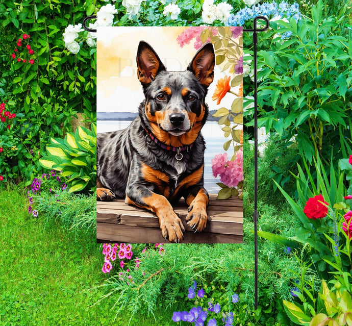 A beautiful Australian Cattle dog on a dock overlooking a Lake.