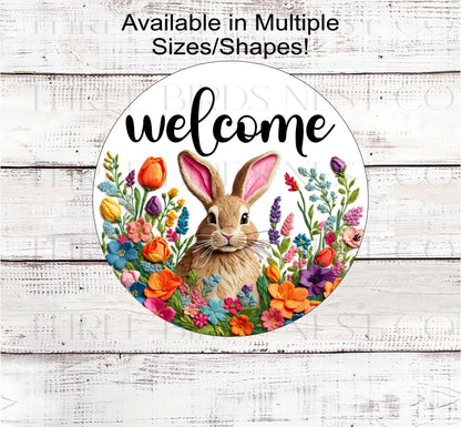A tan Bunny Rabbit in the middle of a frame made of faux embroidered Spring flowers.
