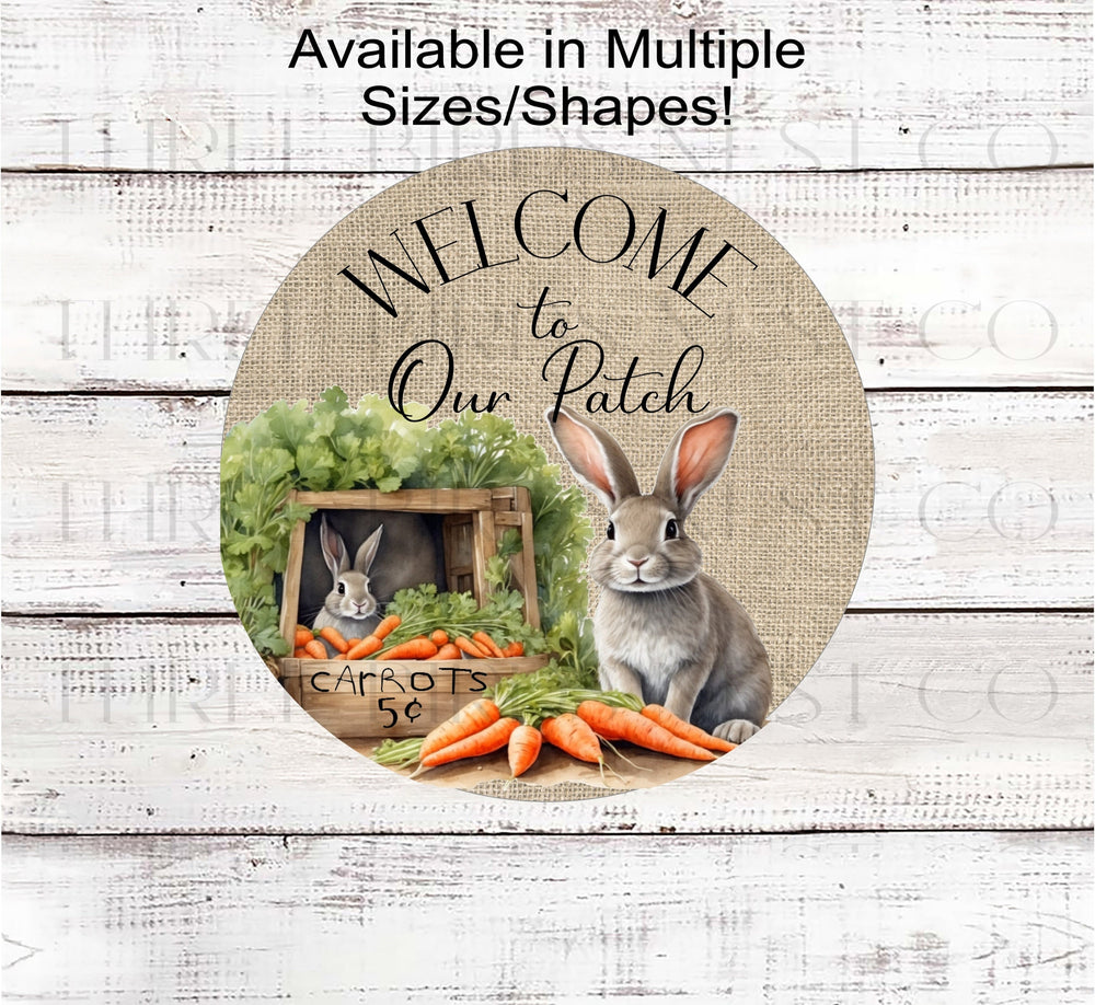 Two Easter Bunnies with carrots for sale and a "Welcome to Our Patch" message