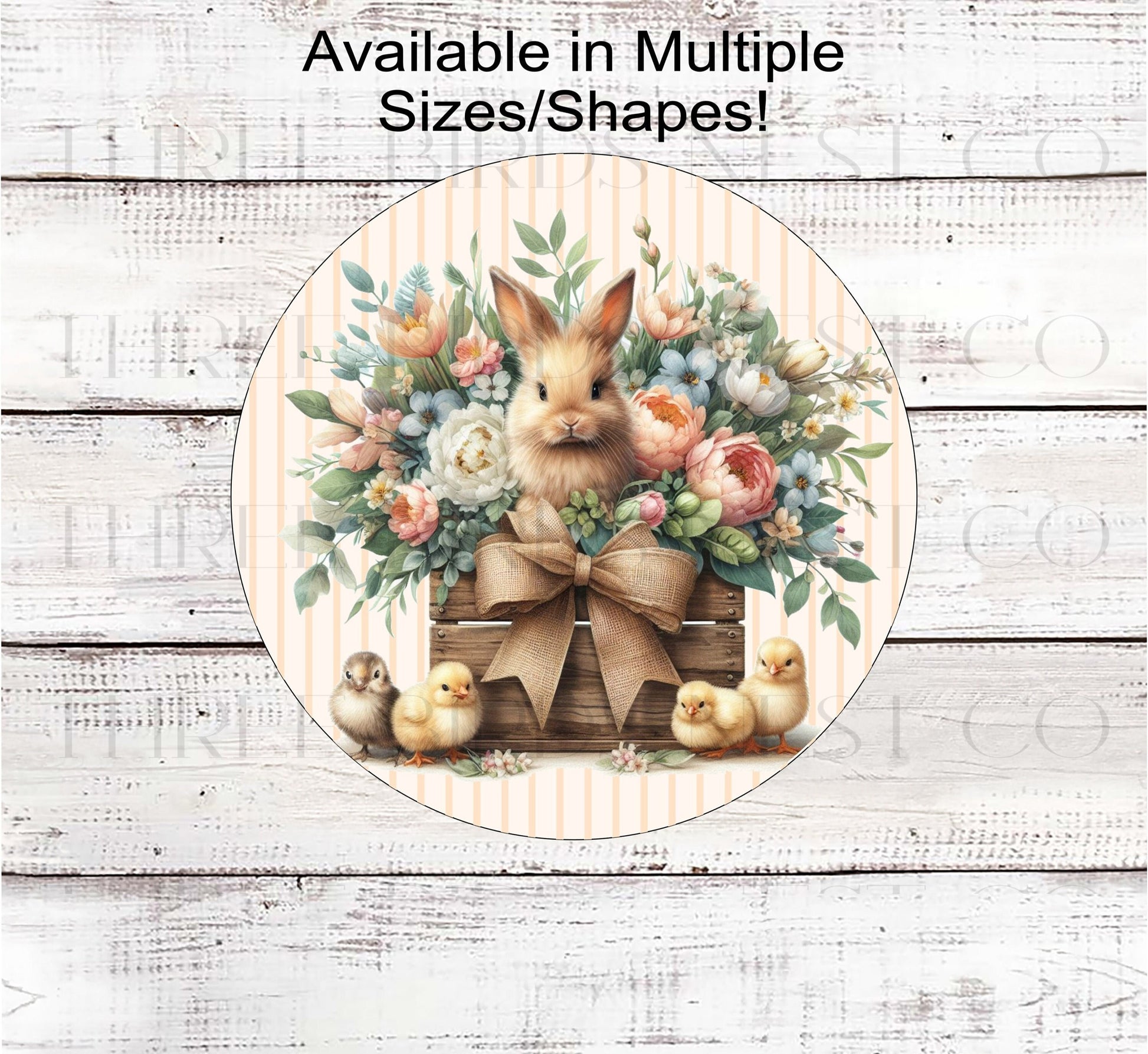 An adorable Easter Bunny in a wood crate surrounded by beautiful flowers and baby chicks.