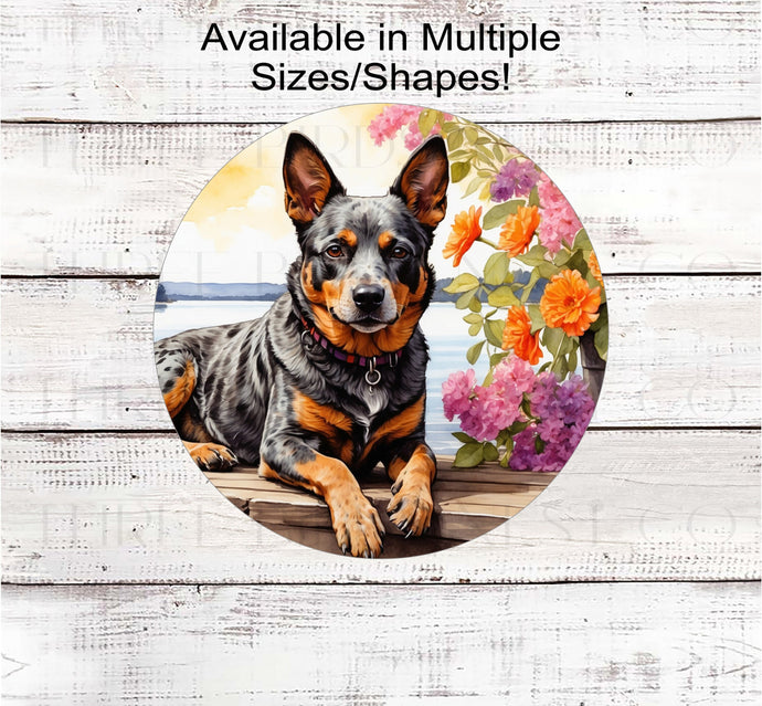 An Australian Cattle dog surrounded by beautiful Spring flowers