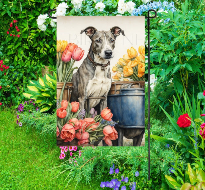 A beautiful Greyhound dog surrounded by gorgeous flowers.