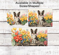 
              A Papillon Dog on a flower cart full of Spring Flower
            