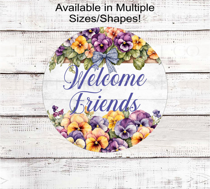 A beautiful Welcome Friends sign with a top and bottom border of beautiful pansies with a gingham bow.