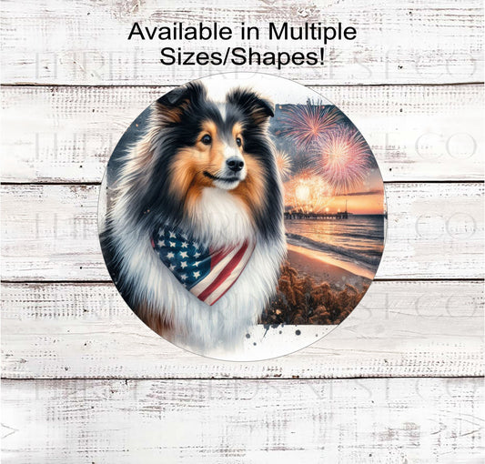 A beautiful Sheltie dog/ Shetland Sheepdog wearing an American Flag Bandanna on a Beach with Fireworks.