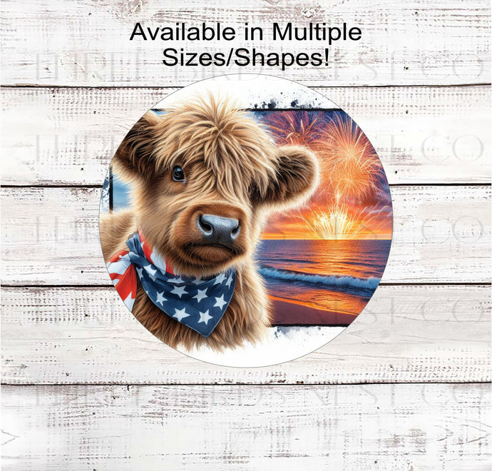 An adorable Scottish Highland Cow Calf wearing an American Flag Bandanna on a Beach with Fireworks