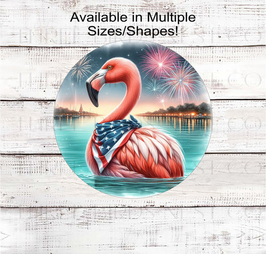 An adorable Pink Flamingo wearing an American Flag Bandanna on a Beach with Fireworks