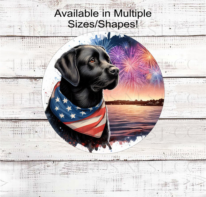 A beautiful black Labrador Retriever dog wearing an American Flag Bandanna on a Beach with Fireworks.