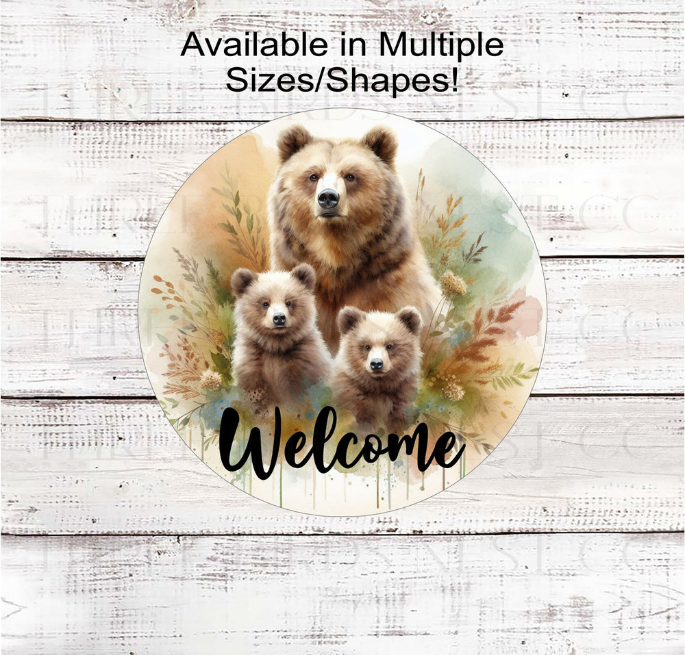 A beautiful Welcome Sign with a Mother Grizzly Bear and her two baby bear cubs.