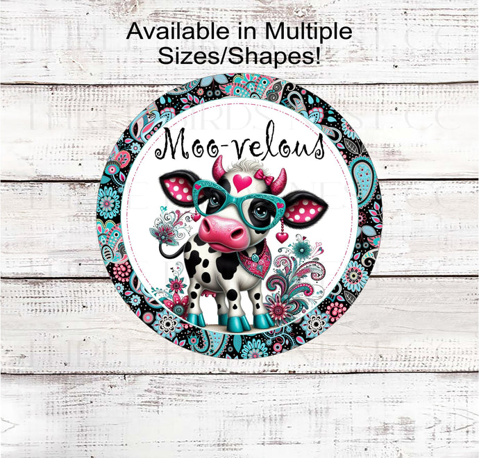 An adorable Moovelous whimsical Cow with a paisley print.